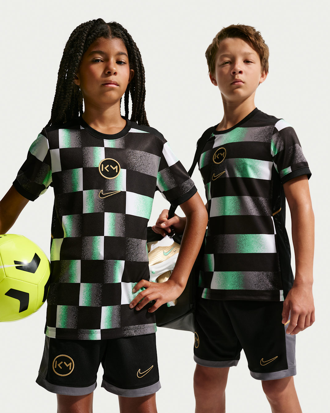 Kylian Mbappé Academy Older Kids' Dri-FIT Short-Sleeve Football Top - Black/Elemental Gold/Metallic Gold