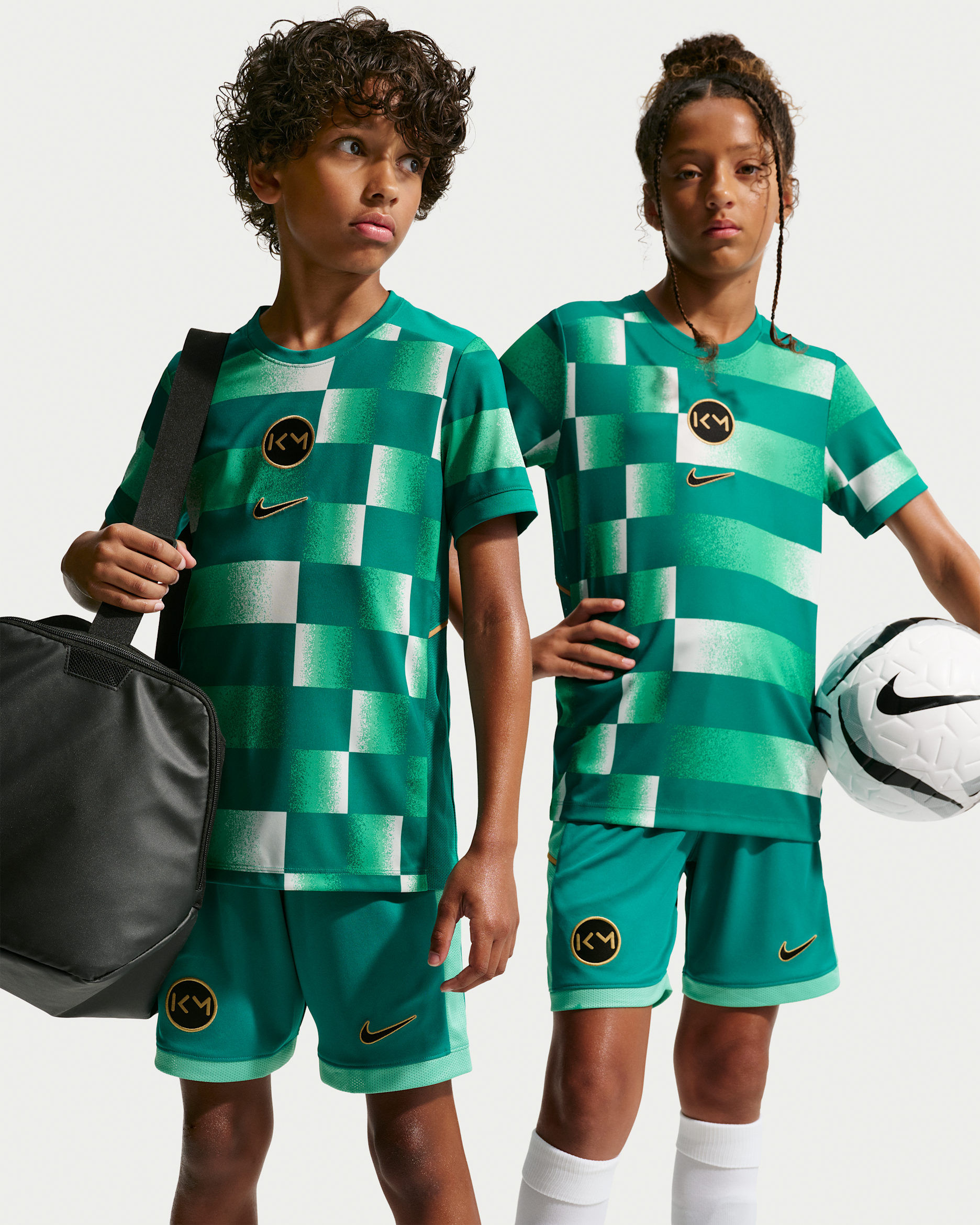Kylian Mbappé Academy Older Kids' Dri-FIT Short-Sleeve Football Top - Rio Teal/Elemental Gold/Metallic Gold