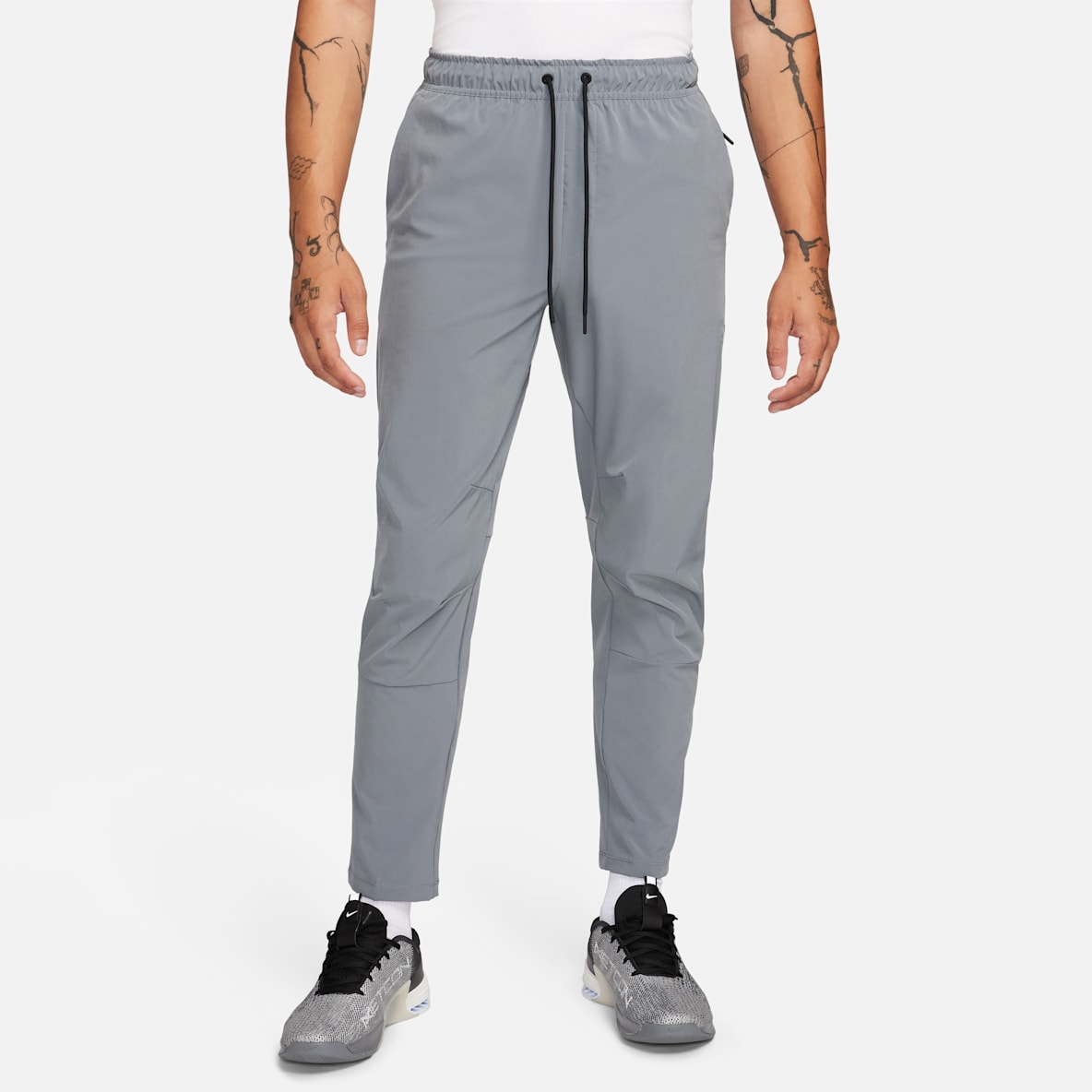Nike Unlimited Pants versátiles Dri-FIT de pierna entallada para hombre